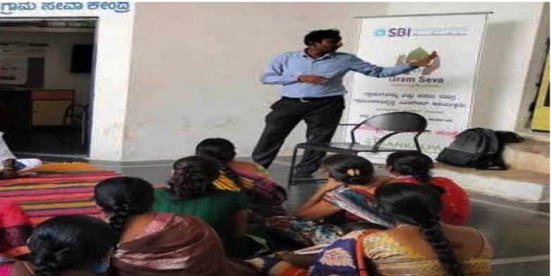 A speaker sharing farming knowledge with a group of farmers